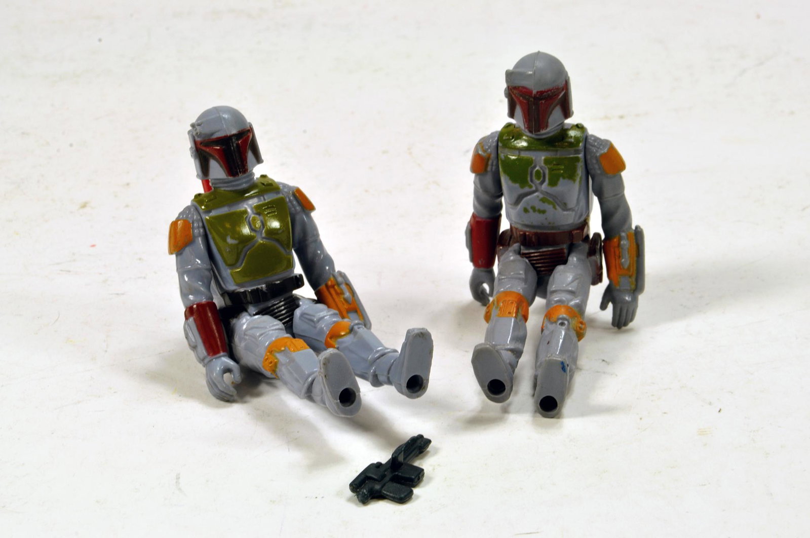 Kenner Early Issue Star Wars Figure issues comprising: Kenner Early Issue Star Wars Figure issues comprising Boba Fett duo . Generally G to E with one weapon. (2)