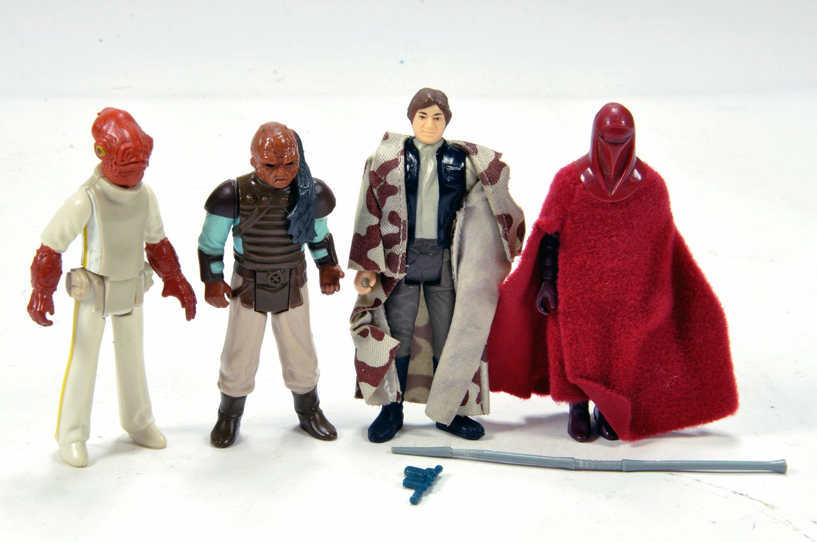 Kenner Early Issue Star Wars Figure issues comprising: Kenner Early Issue Star Wars Figure issues comprising Emperor's Royal Guard, Han Solo, Admiral Ackbar and Weequay with some weapons. Generally VG (4)