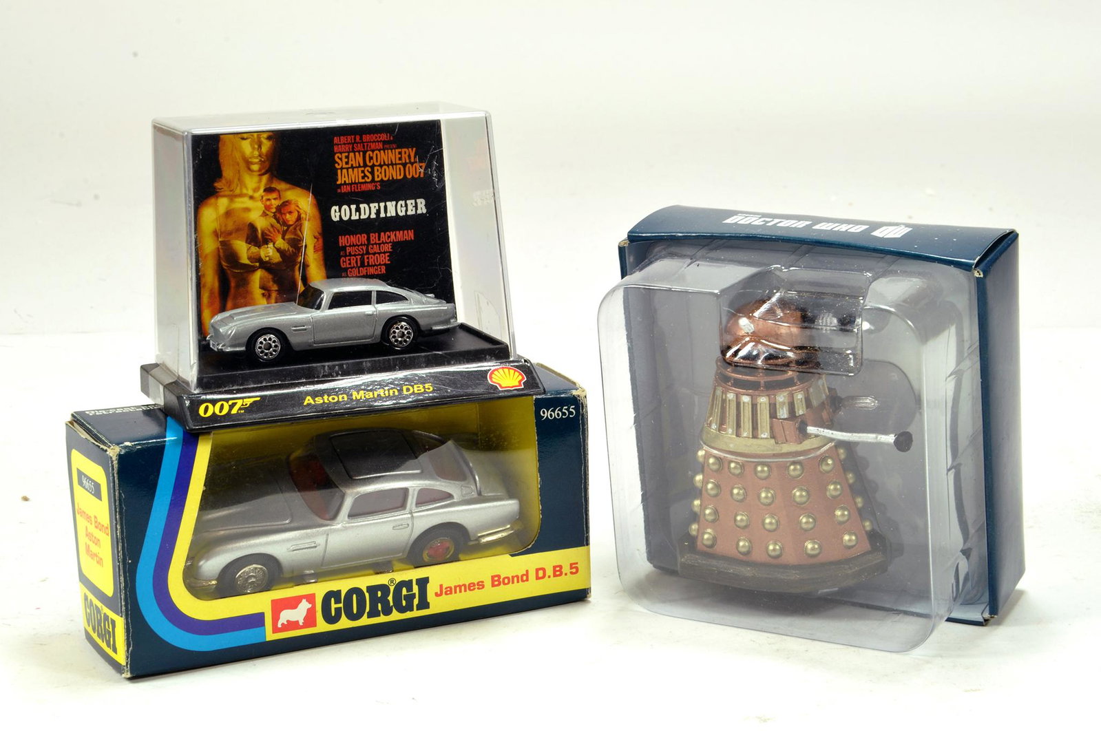 TV Related Trio comprising Dr Who Dalek plus duo of: TV Related Trio comprising Dr Who Dalek plus duo of James Bond Aston Martin issues including Corgi No. 96655. Generally E to NM in Boxes. (3)