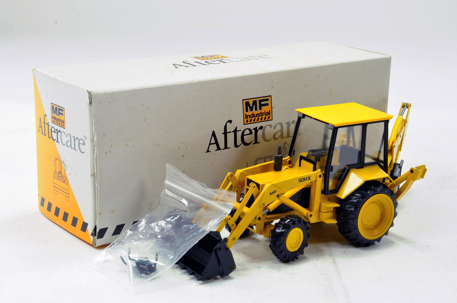 Conrad 1/35 Massey Ferguson 50HX Backhoe Loader. E in: Conrad 1/35 Massey Ferguson 50HX Backhoe Loader. E in Box.