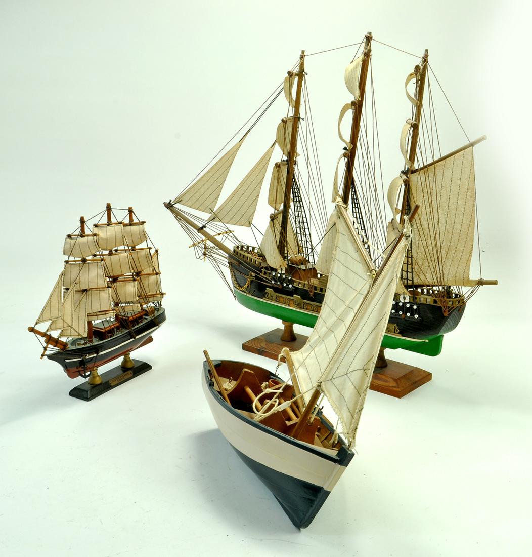 An impressive trio of model ships. Two mounted on: An impressive trio of model ships. Two mounted on plinths. Well made examples. Note: We are happy to provide additional images of any lot. Please email us or contact us via the link on the item page t