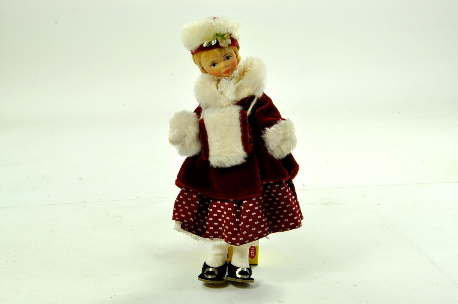 1950s Vintage Cottage Doll, Winter 804 Victorian Girl: 1950s Vintage Cottage Doll, Winter 804 Victorian Girl in red velvet. Made by Old Cottage Toy Co. from Rustington, Sussex, England, she is just over 9 inches tall. These dolls were made by Margaret and