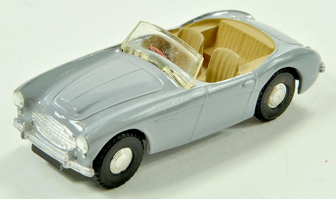 Triang Spot-On No. 105 Austin Healey 100-Six in light: Triang Spot-On No. 105 Austin Healey 100-Six in light grey. Appears very good to excellent. Note: We are always happy to provide additional images for any lot listed in addition to enhanced condition