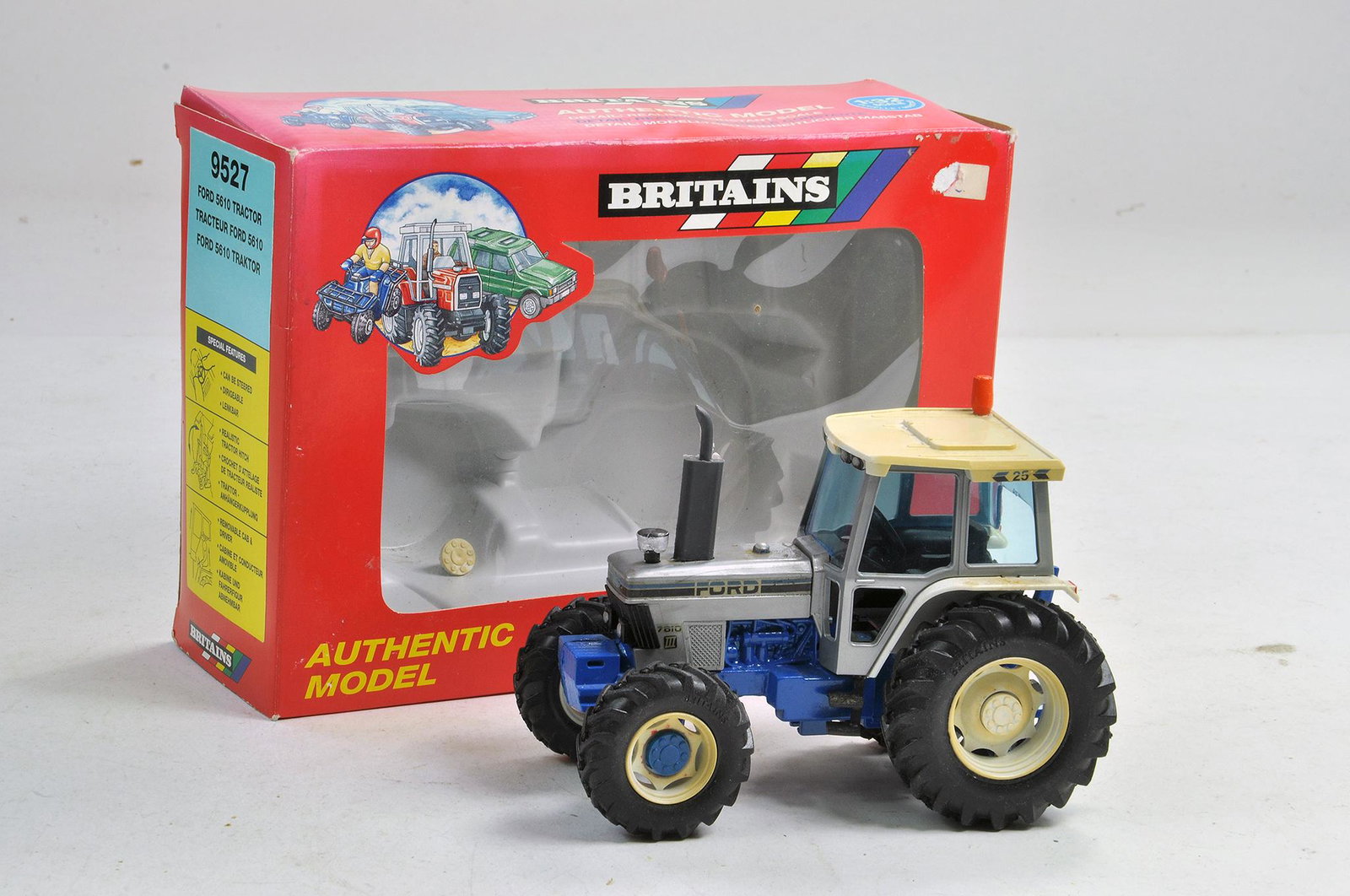Britains Farm Issue comprising 1/32 Ford 7810 Silver: Britains Farm Issue comprising 1/32 Ford 7810 Silver Jubilee Tractor. Code 3 Issue by SD Frater. Very Good, some fading to white plastic, with box. Condition Reports: Please contact us for additional
