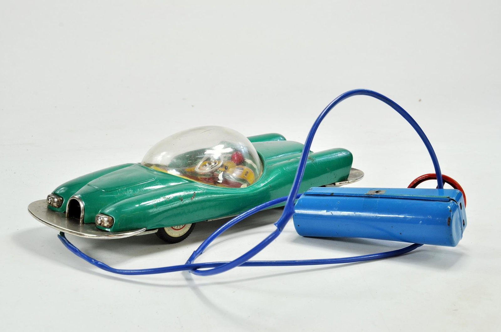 Linemar (Japan) Battery Operated Tinplate Futuristic: Linemar (Japan) Battery Operated Tinplate Futuristic Space Car with cable and remote. In working condition. Toy has some notable signs of wear in places but still a hard to find attractive piece.