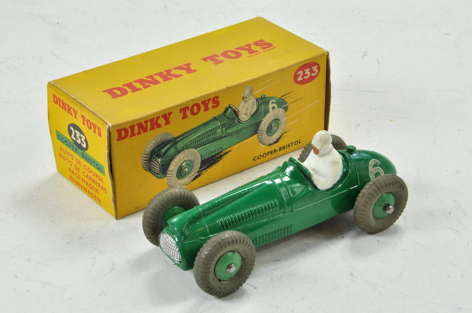 Dinky No. 233 Cooper-Bristol Racing Car. Green body: Dinky No. 233 Cooper-Bristol Racing Car. Green body with white flash and RN '6'. Green cast hubs with '233' on black base. Appears in excellent condition with little or no marks present contained in e