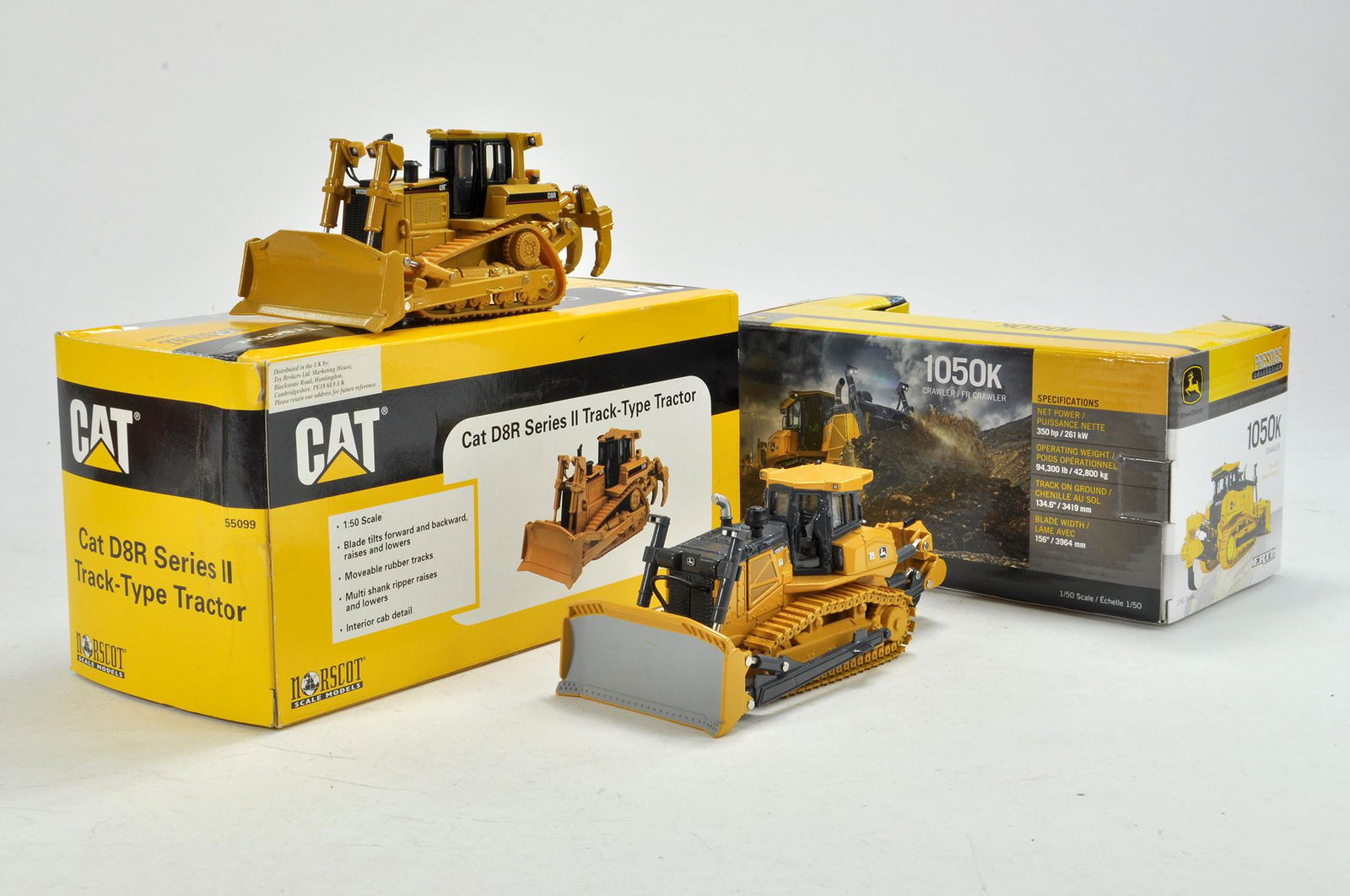 Norscot and Ertl Crawler Tractor duo comprising CAT and: Norscot and Ertl Crawler Tractor duo comprising CAT and John Deere. Both appear excellent with boxes.