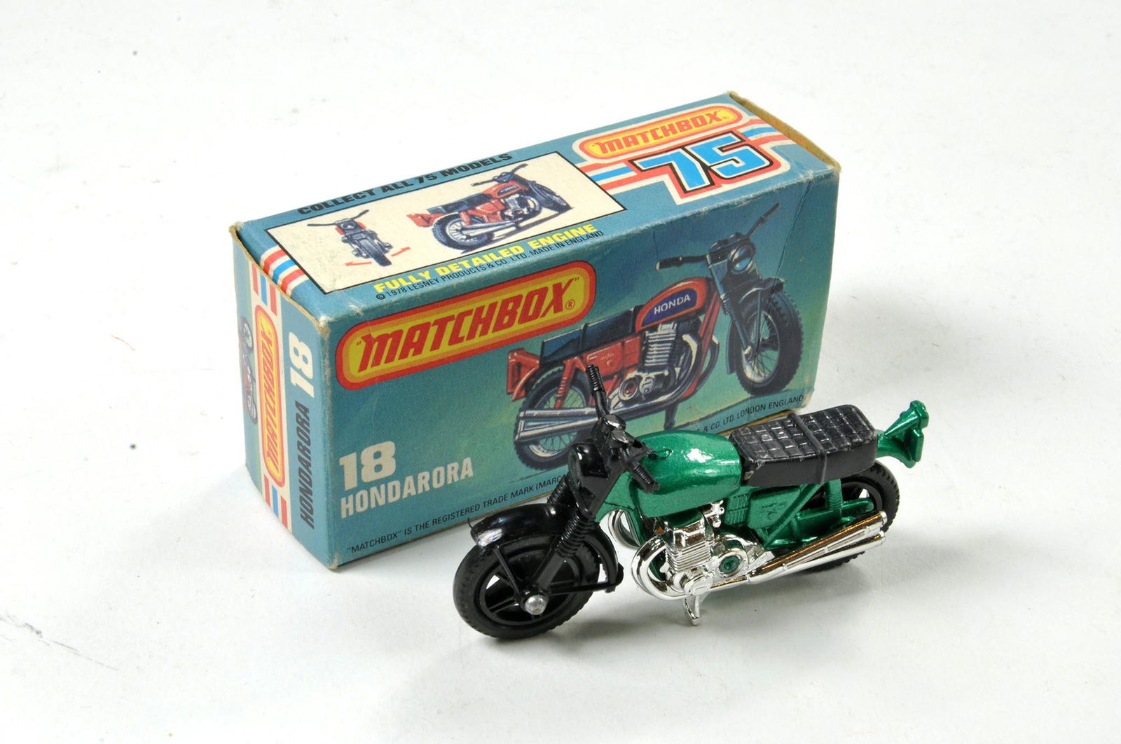 Matchbox Superfast No. 18B Hondarora Motorcycle.: Matchbox Superfast No. 18B Hondarora Motorcycle. Metallic green body, black forks, Chrome engine, no labels, black wheels. Appears excellent in very good (L Type) box, some creasing.