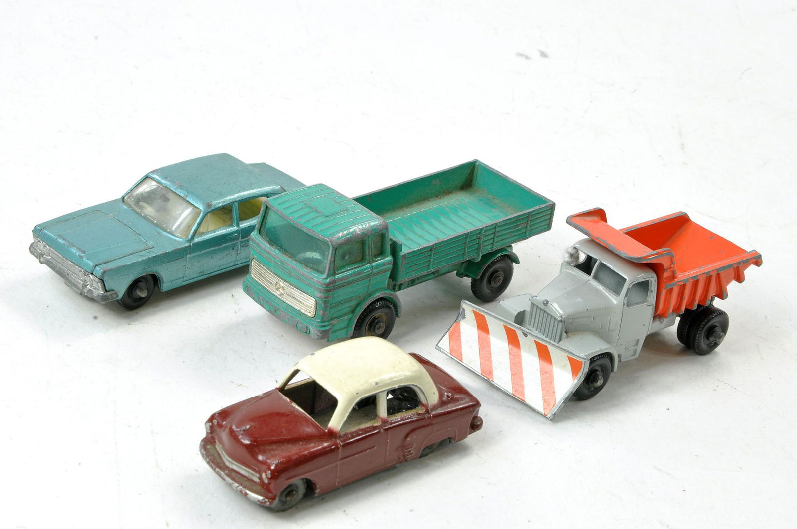 Four Matchbox Regular Wheels comprising Ford Zodiac, Snowplough and two others. All with wear. (1 of 1)