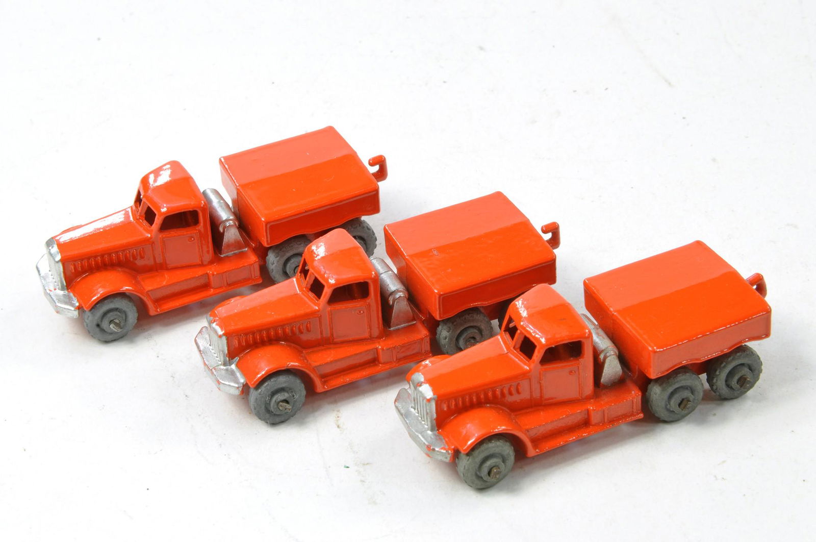 Matchbox Regular Wheels No. 15a Diamond T Prime Mover trio. Orange with silver trim, metal wheels. (1 of 1)