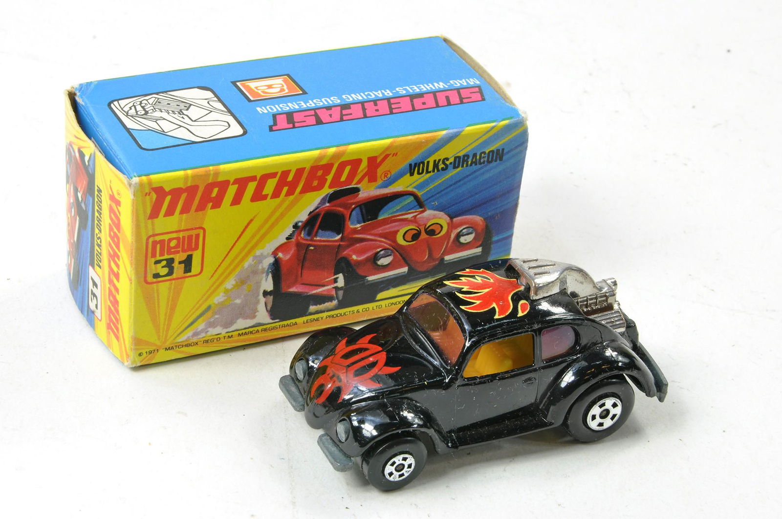 Matchbox Superfast No. 31b Volksdragon Lady Bug. Roman Numerals Issue. Black with yellow interior,: Matchbox Superfast No. 31b Volksdragon Lady Bug. Roman Numerals Issue. Black with yellow interior, clear windows, unpainted base. Generally excellent, in excellent I type box with New.