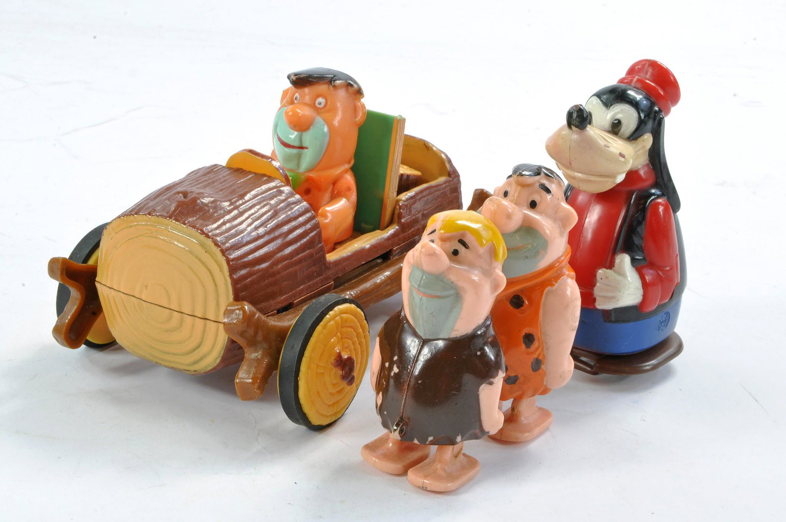 Marx Flintstones Log Car with Fred Driver plus two other plastic toys, Goofy and Flinstones themed. (1 of 1)