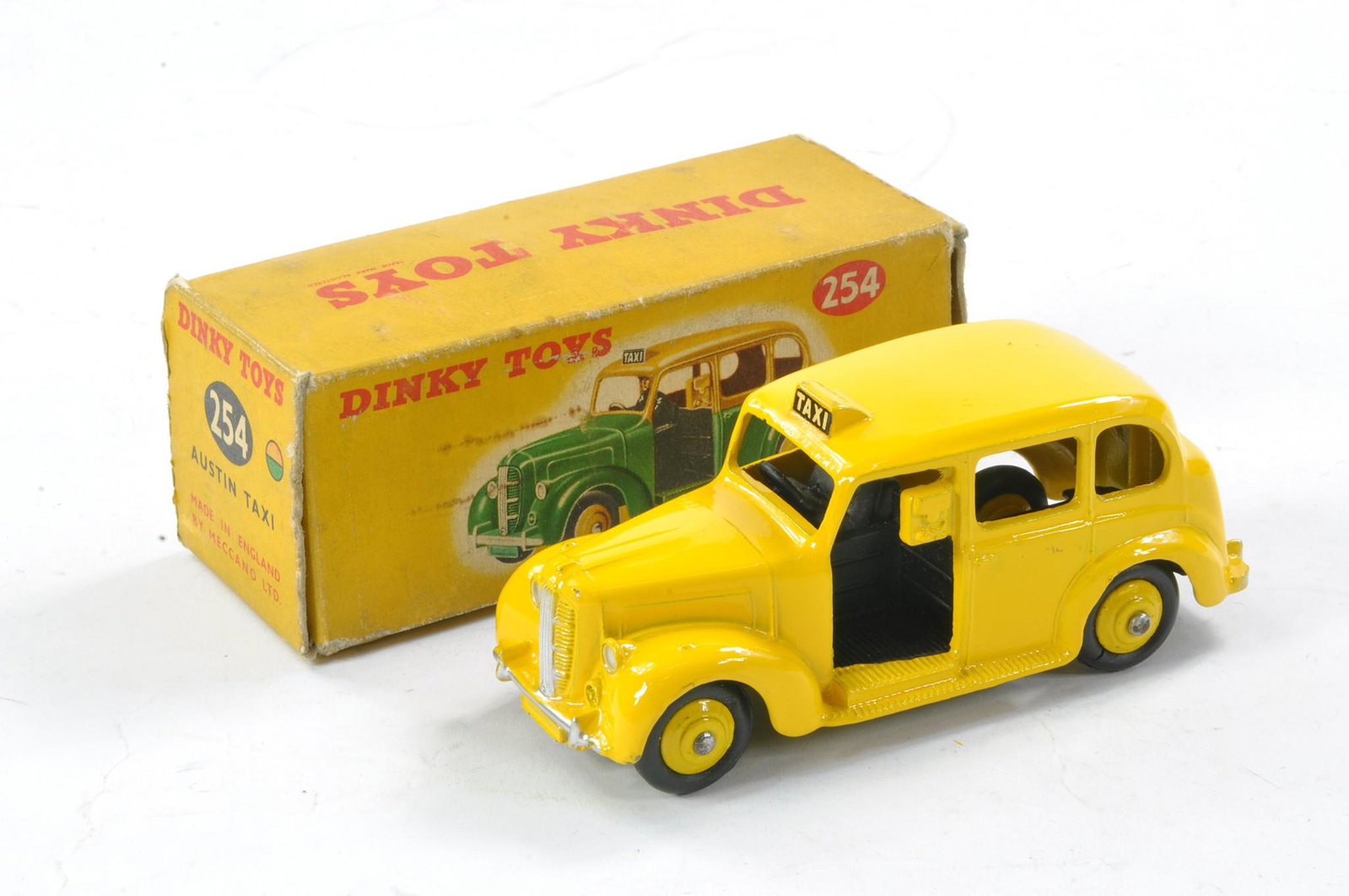 Dinky No. 40h/254 Austin Taxi. Yellow body and ridged hubs, black base and interior including: Dinky No. 40h/254 Austin Taxi. Yellow body and ridged hubs, black base and interior including driver. Generally excellent, the odd surface flaw to paint in fair to good no. 254 box.