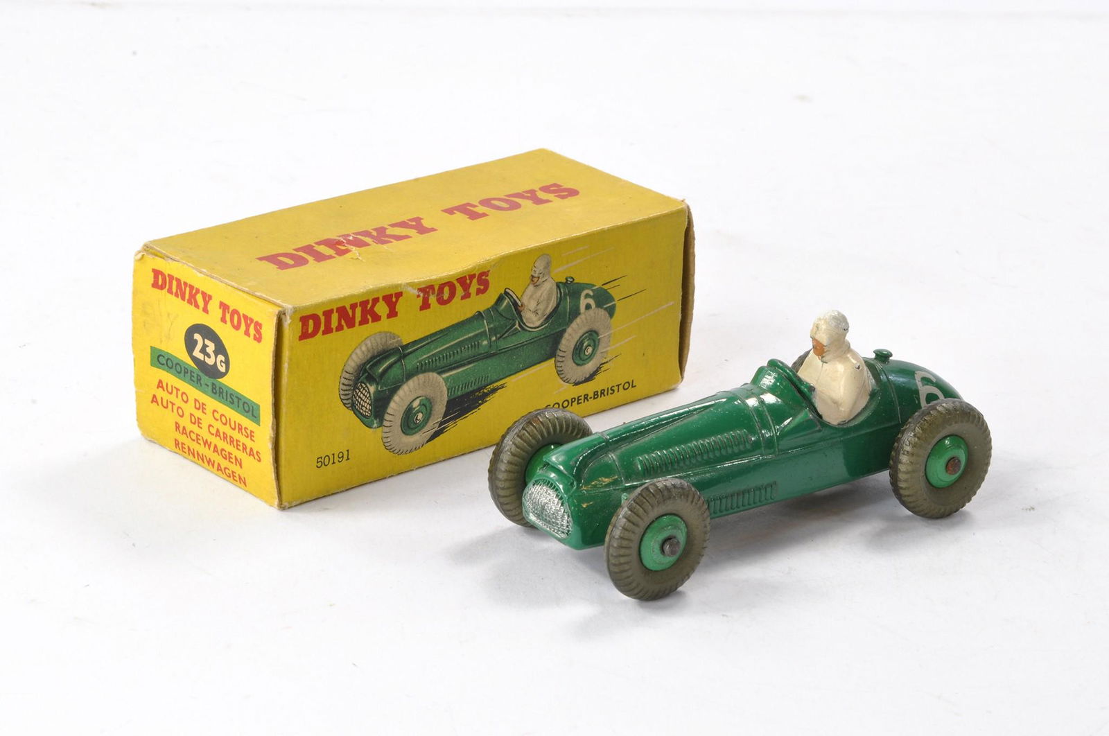 Dinky No. 23G Cooper-Bristol Racing Car. Dark green with mid green hubs. Very good with some minor: Dinky No. 23G Cooper-Bristol Racing Car. Dark green with mid green hubs. Very good with some minor marks in good box with minor signs of wear.