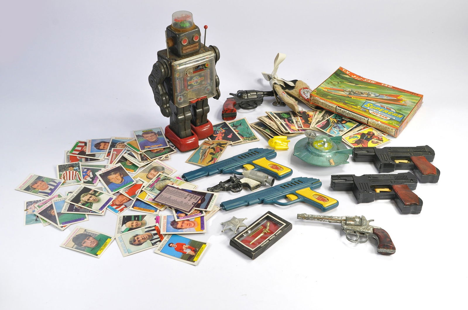 Vintage (Childhood) Toy group comprising eclectic mix of items to include space toys inc Vintage: Vintage (Childhood) Toy group comprising eclectic mix of items to include space toys inc Vintage Robot, Gerry Anderson's Supercar Puzzle by Tower Press, assorted cap guns plus Captain Scarlet Anglo bu