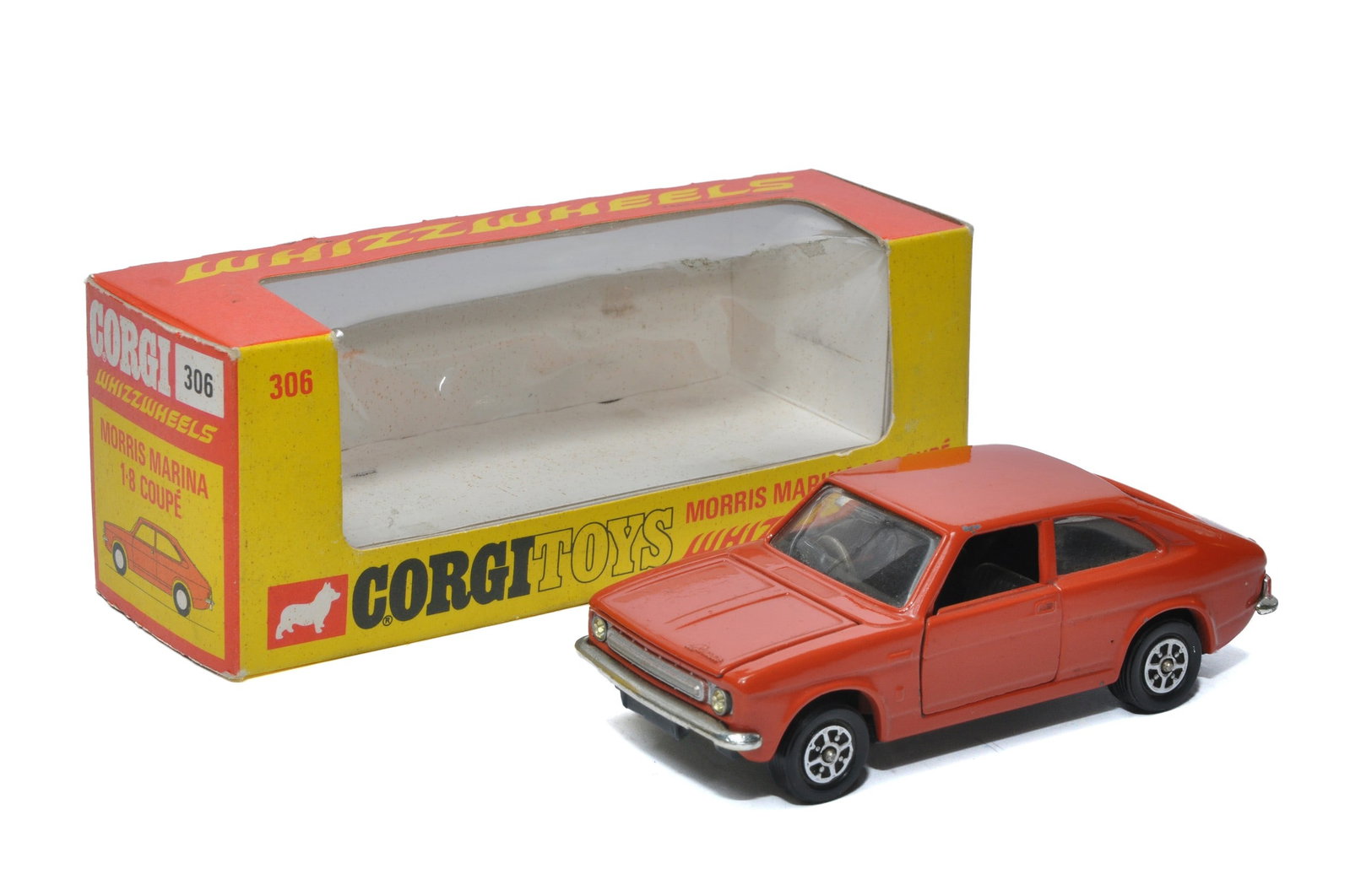 Corgi No. 306 Whizzwheels Morris Marina 1.8 Coupe. Brick Red with dark grey interior. Displays: Corgi No. 306 Whizzwheels Morris Marina 1.8 Coupe. Brick Red with dark grey interior. Displays generally excellent with the odd minor speck and mark. In very good original box. Scarce variation.