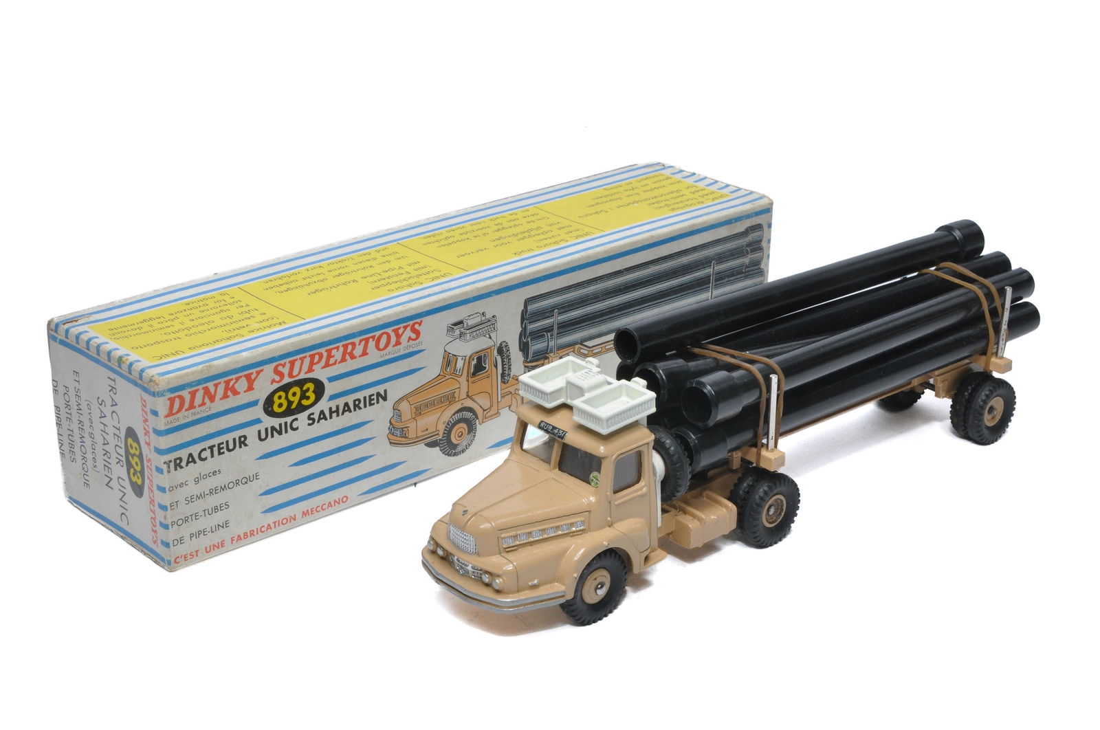 French Dinky No. 893 Unic Sahara Tractor with Pipe Trailer and Load. Displays very good to (1 of 2)