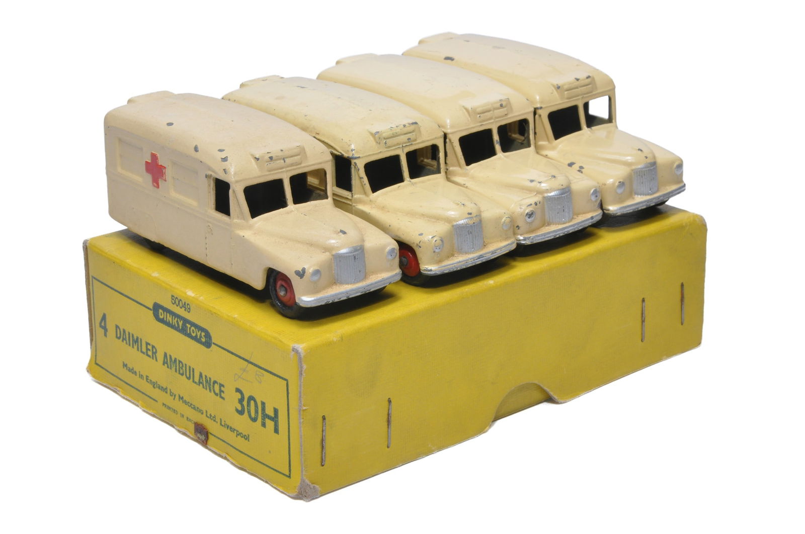Dinky No. 30h Trade Pack Daimler "Ambulance" containing 4 examples. Display Fair in generally Good (1 of 2)