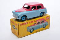 Dinky No. 154 Hillman Minx Saloon. Single issue is in two-tone cerise and light blue, with mid-blue