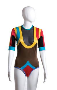 GIORGIO DI SANT'ANGELO TWO BODYSUIT 1971-1972: GIORGIO DI SANT'ANGELO TWO BODYSUIT 1971-1972 a) Colour blocked pattern lycra, short sleeves; bust 84 cm - waist 70 cm Condition grade C b) White lycra with parrots pattern, long sleeves, murrina