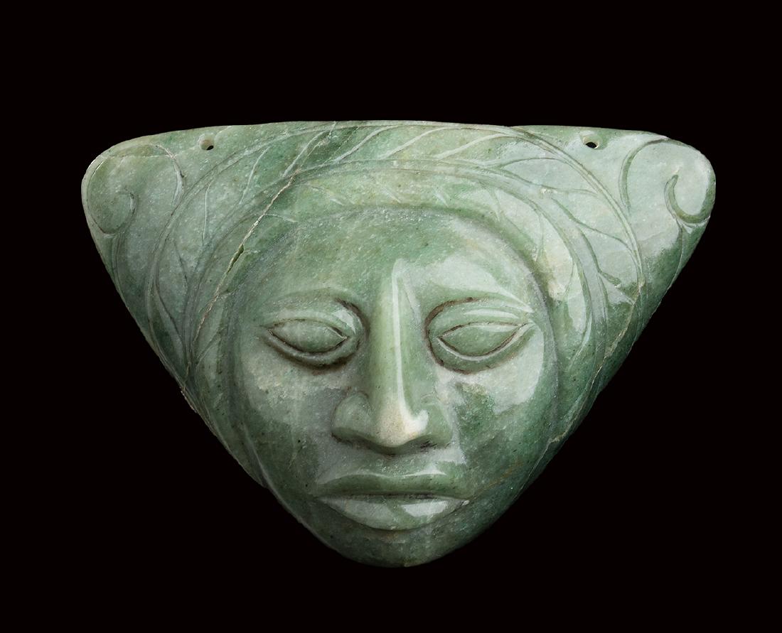 A GREEN JADE MASK Olmec style 13,3 x 19 cm: A GREEN JADE MASK Olmec style 13,3 x 19 cm Provenance: Giovanni Testori (1923-1993) collection.