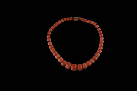 JAPANESE CORAL NECKLACE: Japanese Coral necklace Japanese coral necklace, white stained. Gold plated closure set on a round cabochon natural coral. Total weight gr 101. The lot is accompanied by the certificate DDD number 000