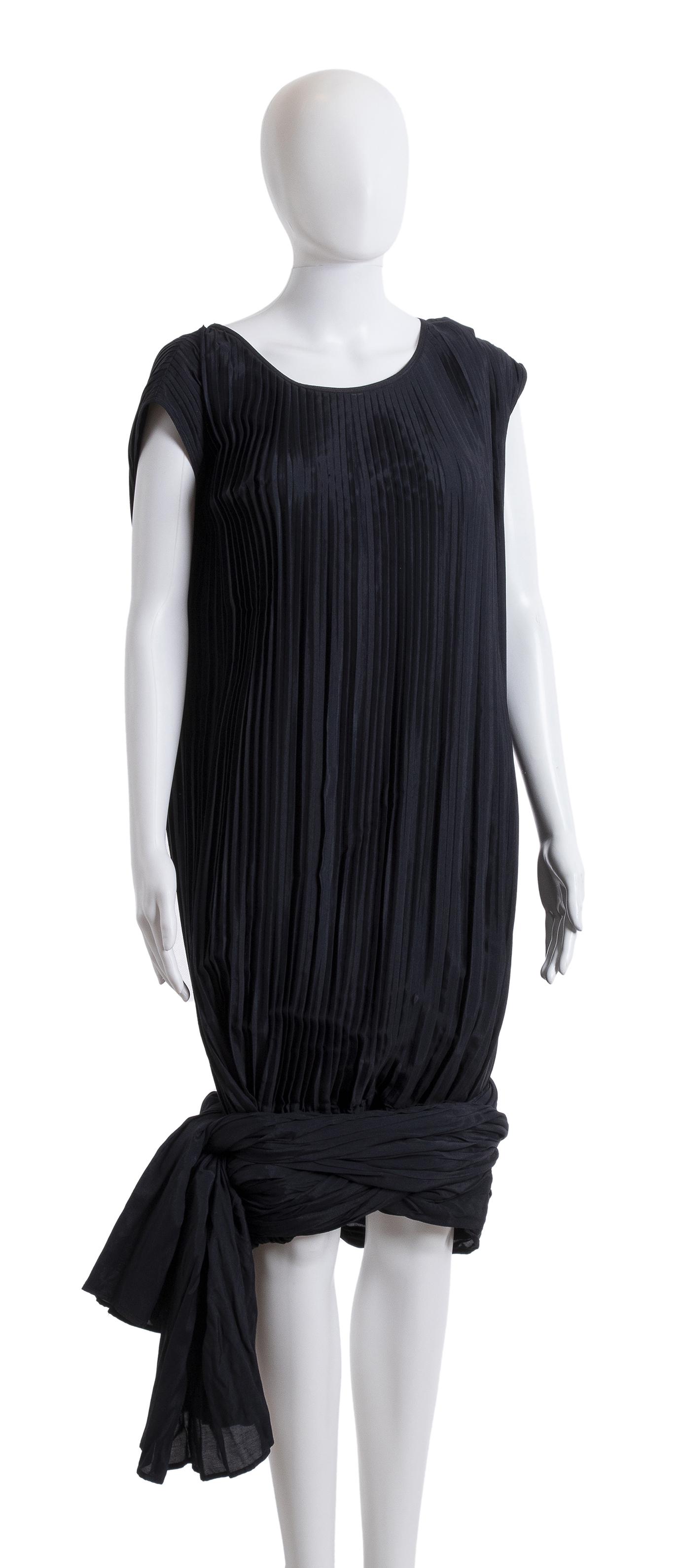 JEAN PAUL GAULTIER POUR GIBOâ€™ MIXED SYNTHETIC FABRIC: JEAN PAUL GAULTIER POUR GIBOâ€™ MIXED SYNTHETIC FABRIC DRESS 90s Dark grey poly blend pleated dress, knee high sash with two tying panels, Bust 100 cm General condition grading B