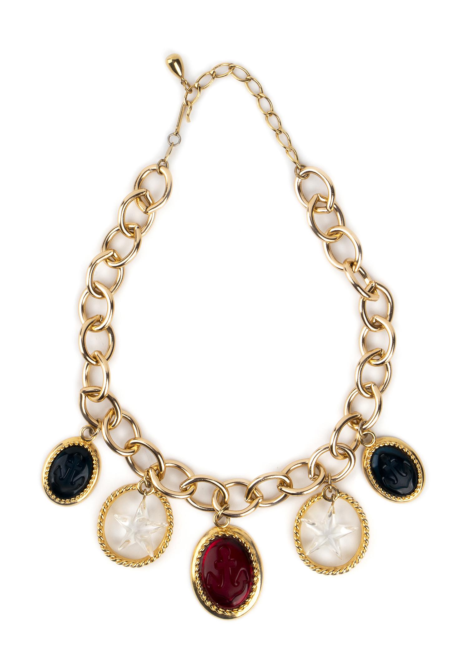 TRIFARI TM GILDED METAL ENGRAVED, GLASS PASTE AND: TRIFARI TM GILDED METAL ENGRAVED, GLASS PASTE AND CHARMS NECKLACE 80s A gilded metal engraved colored glass paste and charms necklace General conditions grading B