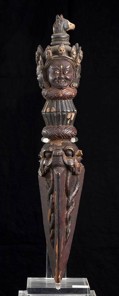 A WOOD PHURBA Tibet, 19th century: A WOOD PHURBA Tibet, 19th century 48 cm Provenance: Fabrizio Savi collection, acquired in the early 2000s. The phurba is a three-bladed knife used in Tibetan Buddhist rituals.