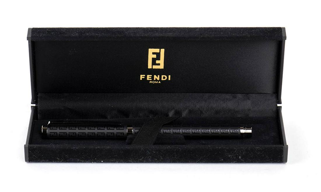 Fendi, ballpoint pen: black barrel and cap with Fendi logos and chrome trims. Cap signed "Fendi". Lenght 13.5 cm. Item condition grading: **** good. Original Fendi boxe.