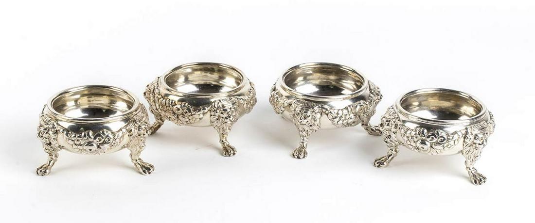 Four English sterling silver Georgian salt cellars -: Four English sterling silver Georgian salt cellars - London 1747, mark of JAMES GOULD with lion mask headed paw feet on a compressed circular body. Sterling silver, fully hallmarked London 1747-1748,