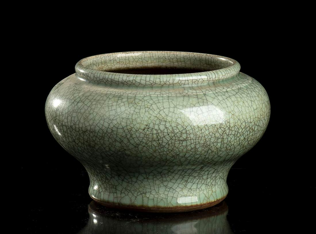 A CÃ‰LADON GLAZED CERAMIC JAR China, 19th-20th century (1 of 2)
