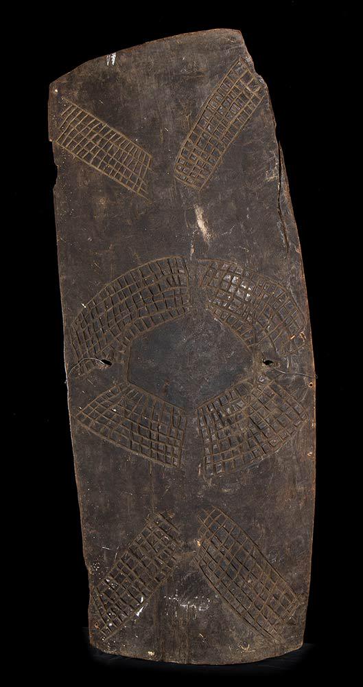 A WOOD SHIELD Papua New Guinea: A WOOD SHIELDPapua New Guinea 112,5 x 45 cmProvenance: Italian private collection, purchased in Sidney at the end of the 1990s.