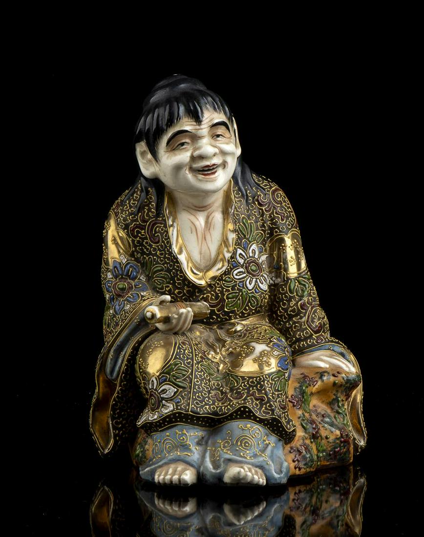 A POLYCHROME ENAMELLED AND GILT 'SATSUMA' CERAMIC FIGURE OF KANZAN   Japan, Meiji period (1 of 3)