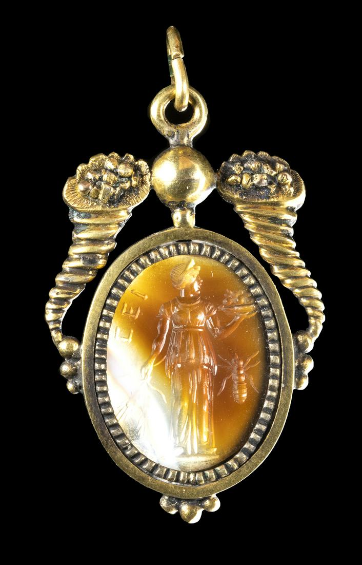 A LATE RENAISSANCE BANDED AGATE INTAGLIO SET IN A GOLD PENDANT. THE ABUNDANCE WITH AN ANT. (1 of 3)