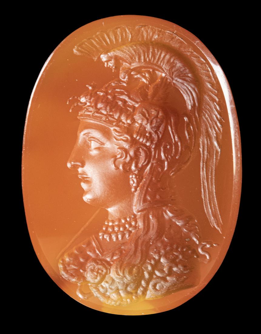 A NEOCLASSICAL CARNELIAN INTAGLIO. BUST OF ATHENA PARTHENOS.: A NEOCLASSICAL CARNELIAN INTAGLIO. BUST OF ATHENA PARTHENOS. Late 18th- Early 19th century A.D.17x24x5,5 mmThis beautiful bust is engraved after a famous Roman red jasper intaglio signed by Aspasios (