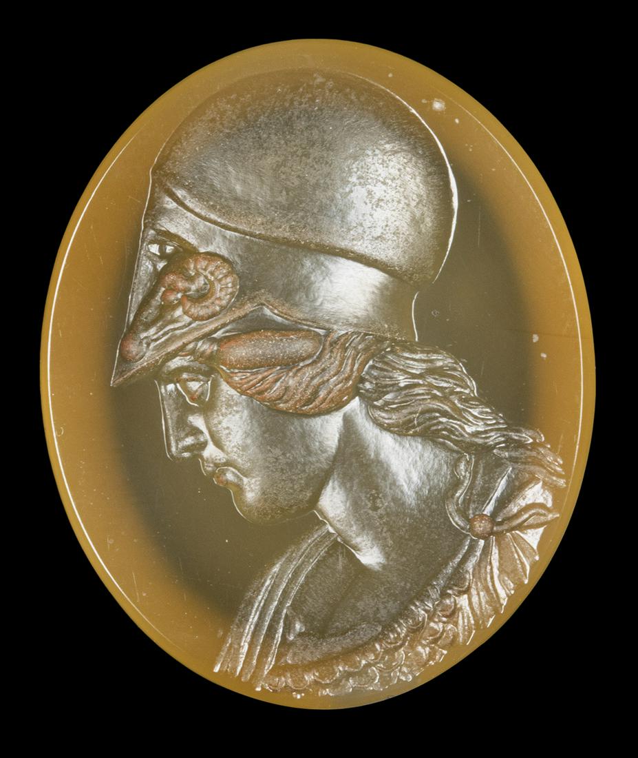 A NEOCLASSICAL AGATE INTAGLIO. BUST OF HELMETED ATHENA.: A NEOCLASSICAL AGATE INTAGLIO. BUST OF HELMETED ATHENA. 19th century 20x24x4 mmThe goddess is facing left with the face slightly bent. This model refers to Nathaniel Marchant (1739-1816) work. Provena