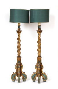 A pair of italian lacquered and gilded torchieri: Height x width x depth: 136 x 38 x 38 cm.Provenance: Family Princes Gonzaga of Mantua.Provenance: Bergamo private collection.carved wood, finely gilded and decorated with floral motifs. The vertical s