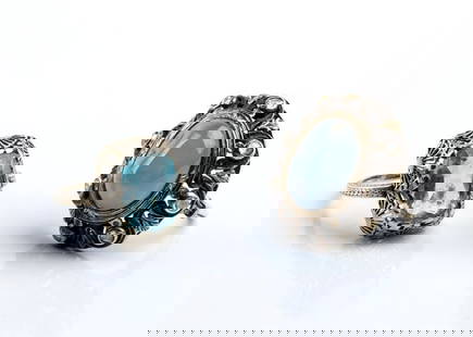 Two gold, silver and platinum rings with sapphire and aquamarine: one gold and silver ring set with a sapphire cabochon surrounded by diamonds; a platinum openwork ring set with aquamarine.Sapphire ring: IT size 13 - US size 6 1/2. Aquamarine ring: IT size 16 - US s