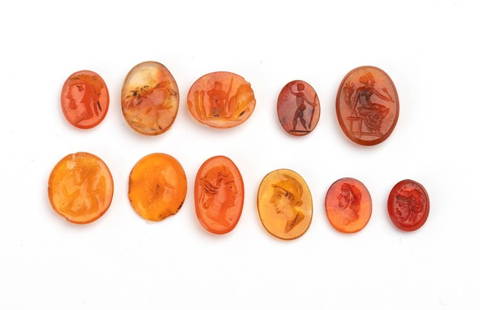 Lot of 11 carvings in carnelian agate: Various subjects inspired by classical models: three male profiles; one profile depicting a warrior; two female profiles with close-cropped hair; three figures depicting allegories from Roman mytholog