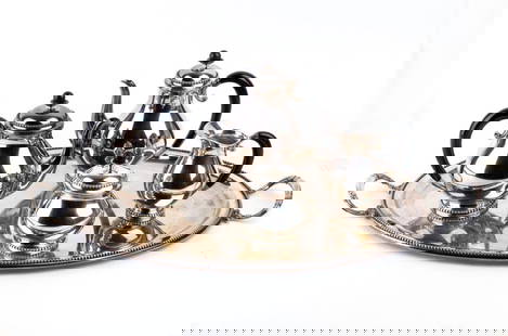 Solid silver italian tea set: Tea service in 800/1000 silver, consisting of teapot, coffee pot, sugar bowl, dairy and an elliptical tray, decorated with small spherical edges and black handles.Hallmarked “800 - 20 AL - R E C&rdq