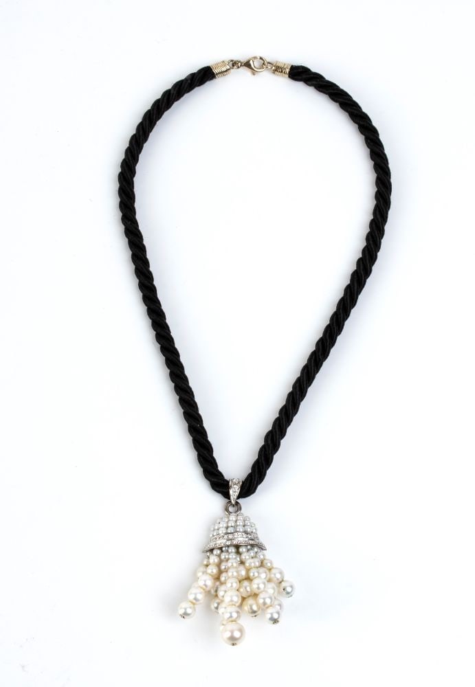Diamond pearl gold pendant necklace -: 18k white gold tassel motif pendant with micro pearls, diamond details and saltwater cultured pearl fringe.The pendant hangs from a fabric cord with a gold hook clasp.No. 29 diamonds, round shape, bri