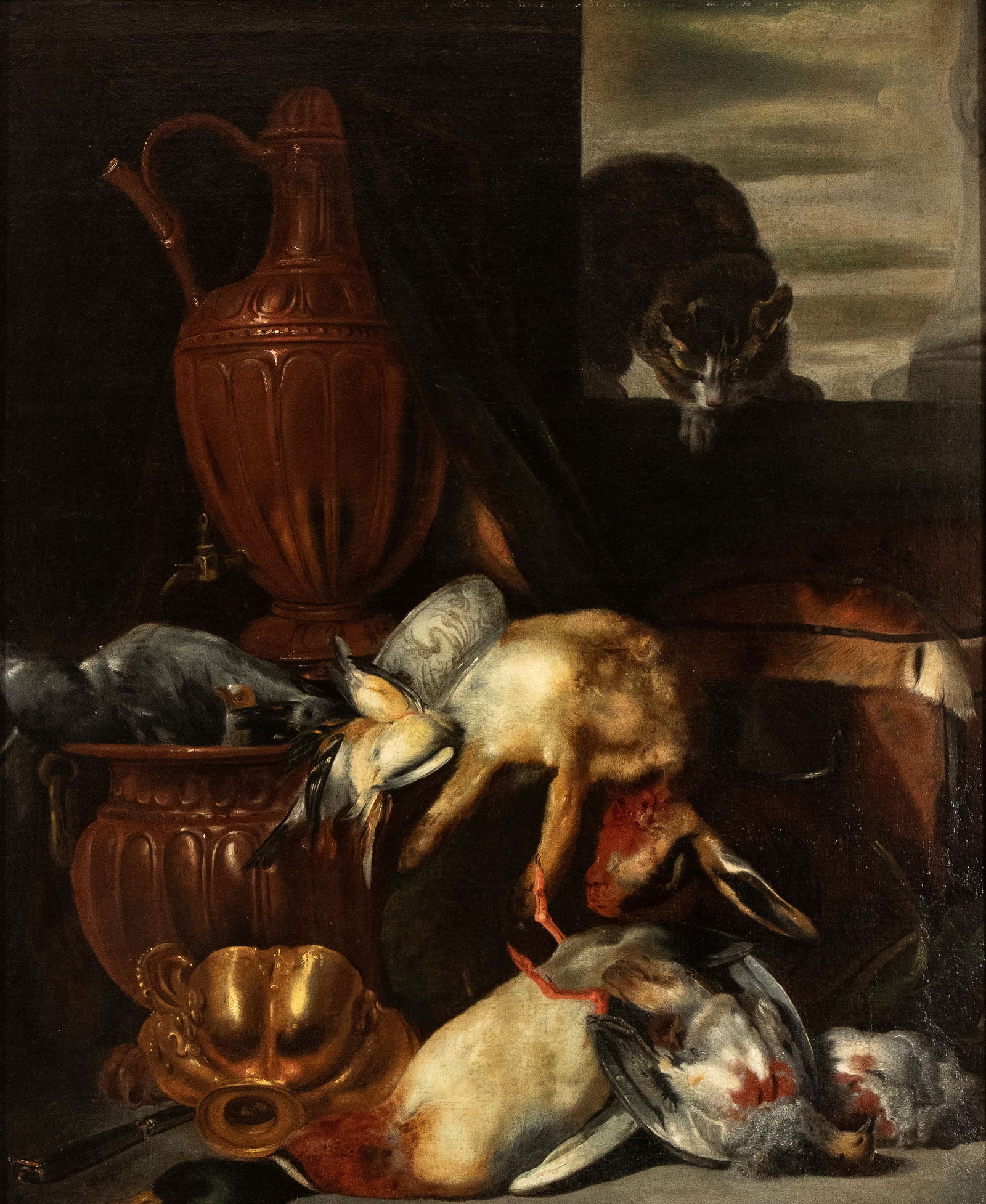 Artista fiammingo, XVII secolo (): Still life with game, cat, and metalware Oil on canvas cm. 96,5x82. Framed This high-quality still life presents a particularly elaborate composition, combining game laid out on a ledge - including va