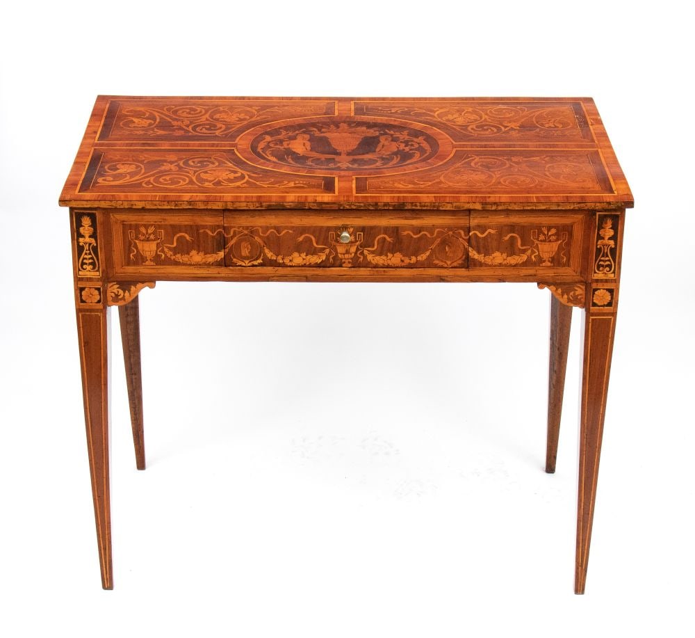 Louis XVI inlaid writing desk - Lombardy, 18th century: Louis XVI inlaid writing desk - Lombardy, 18th centuryHeight x width x depth: 74 x 87 x 47 cma walnut center desk with intricate inlays of fruitwood featuring floral and geometric motifs. It features