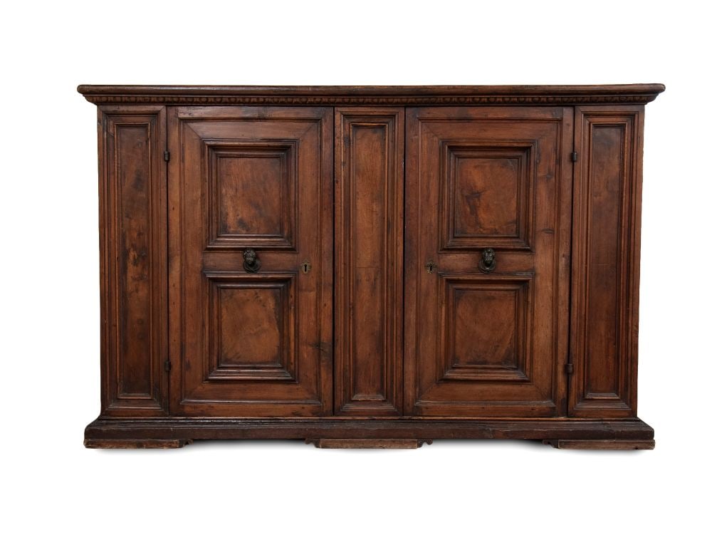 Baroque sideboard in walnut - Central Italy, 17th century: Baroque sideboard in walnut - Central Italy, 17th centurywith paneled doors featuring a roundel-shaped knob in the center, carved along the edge of the lower panel. Original locks, hinges, and hardwar
