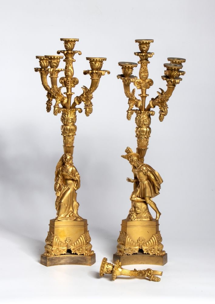 Pair of French gilded bronze candlesticks - France, mid-19th century: Pair of French gilded bronze candlesticks - France, mid-19th centuryHeight x diameter: 66 x 18 cma multi-tiered candelabra featuring Renaissance figures mounted on a base decorated with foliage motifs