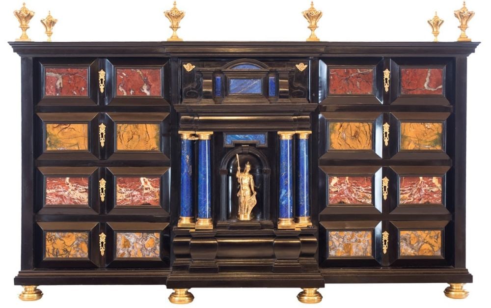 Coin cabinet made of ebony, semi-precious stones, and gilded bronze - Central Italy, 18th century: Coin cabinet made of ebony, semi-precious stones, and gilded bronze - Central Italy, 18th centuryHeight x width x depth: 78 x 120 x 45 cmwith an architectural design and resting on bulbous feet. The f