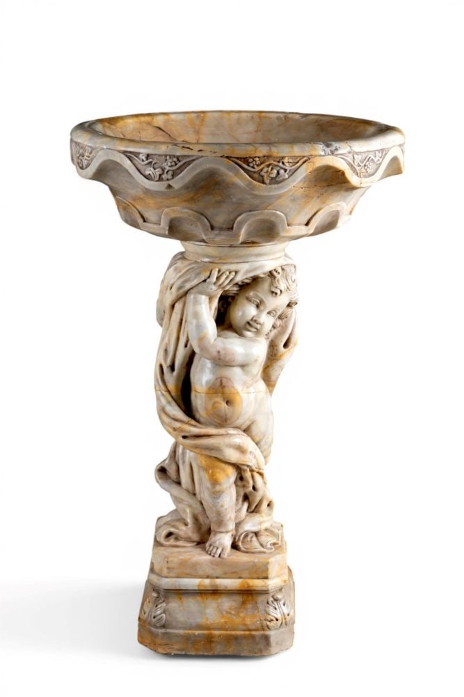 Bath supported by a cherub - Late 19th century: Bath supported by a cherub - Late 19th centuryHeight x diameter: 115 x 70 cmmade of Verona yellow marble.This lot is currently in storage in Milan with the owner. To view it in person, please contact:
