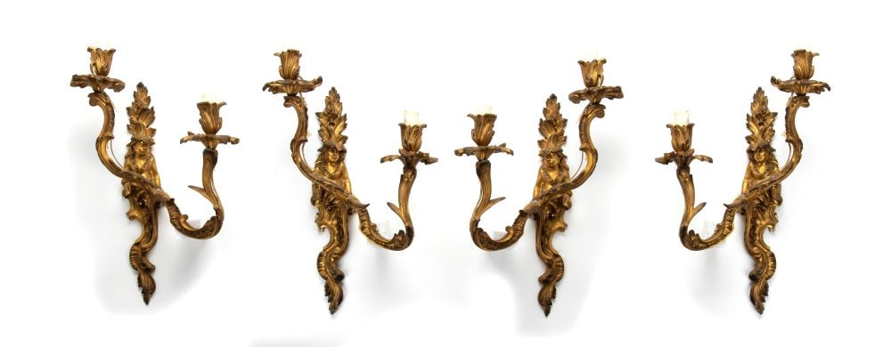 Four French gilded appliques, Louis XVI - 18th century: Four French gilded appliques, Louis XVI - 18th centuryHeight x width x depth: 46 x 25 x 18 cm.two-light gilt bronze wall sconces with finely chiseled oriental figures. Volute arms with plant and flora