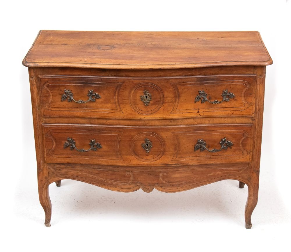 Provençal walnut chest of drawers, Louis XV style - France, 18th century: Provençal walnut chest of drawers, Louis XV style - France, 18th centuryHeight x width x depth: 85 x 108 x 51 cma contoured, curved top; a front panel with two carved drawers; carved, rusticated side